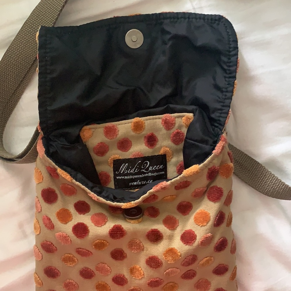 Midi Queen tan square button-close purse with multi-color polka dots